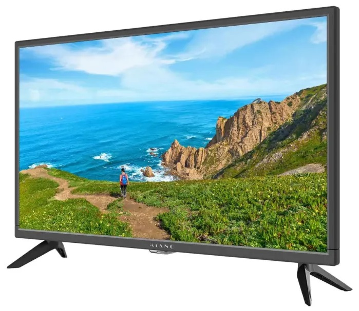 Telewizor wyświetlający krajobraz nadmorski z osobą idącą ścieżką, pod błękitnym niebem.