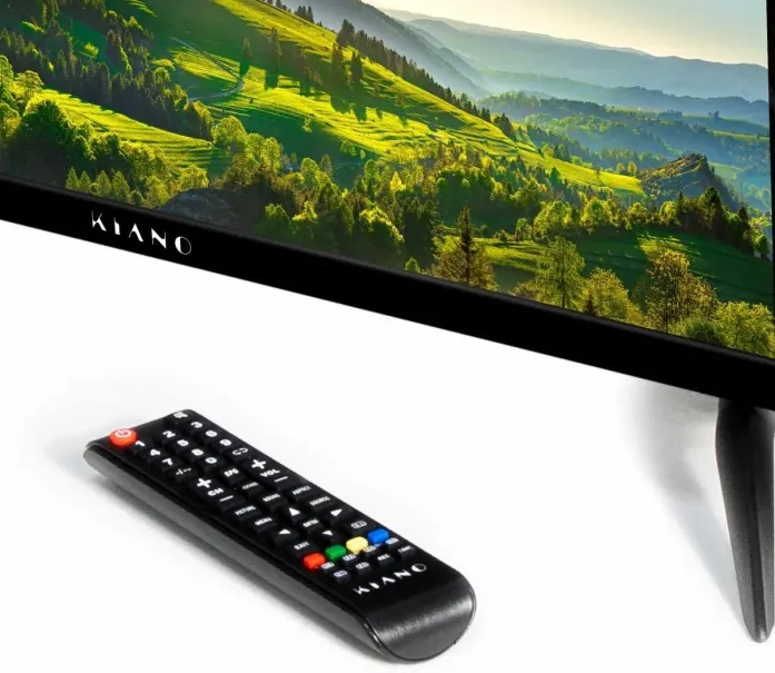 Telewizor i pilot na białej powierzchni; telewizor wyświetla obraz krajobrazu.