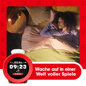 Schlafende Frau im Bett, neben einem roten Mario-Wecker, Text auf Deutsch.