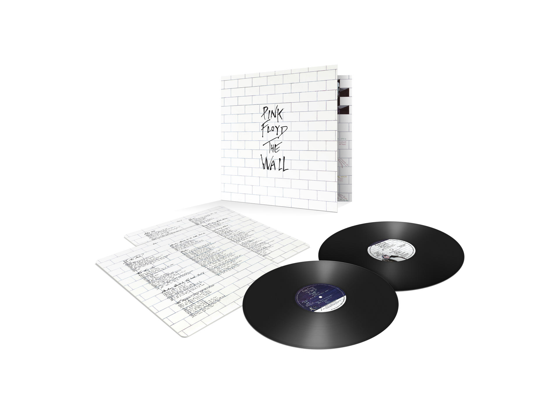 Zwei Schallplatten und ein Buch mit Text.