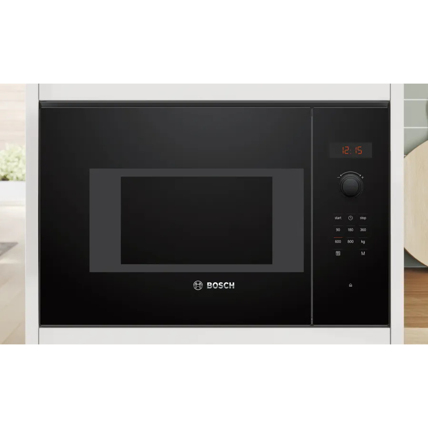 A black microwave oven with a digital display and control panel, built into a white cabinet.