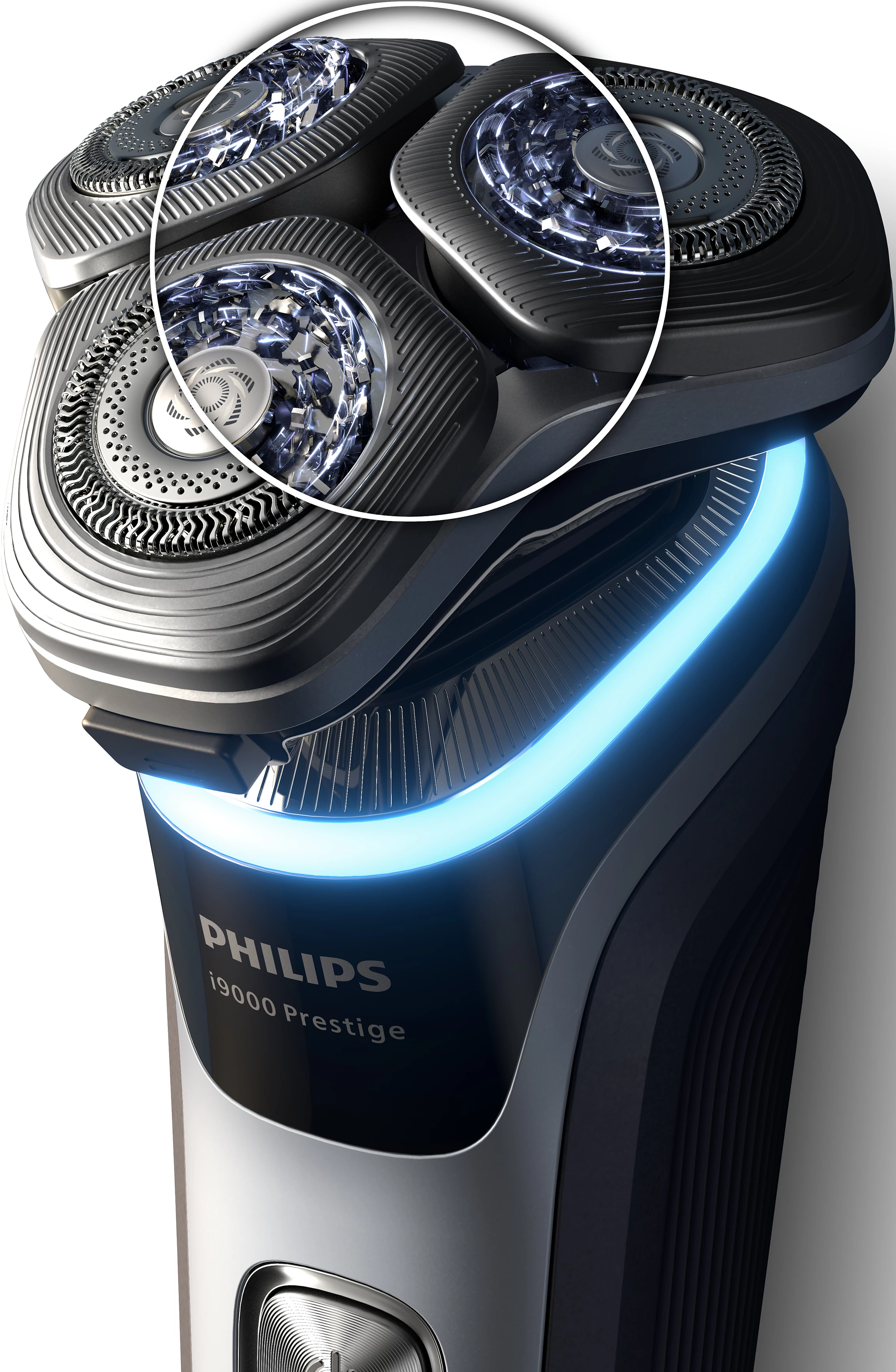 Primo piano di un rasoio elettrico Philips. Tre testine rotanti con lame, colore argento e luce blu.