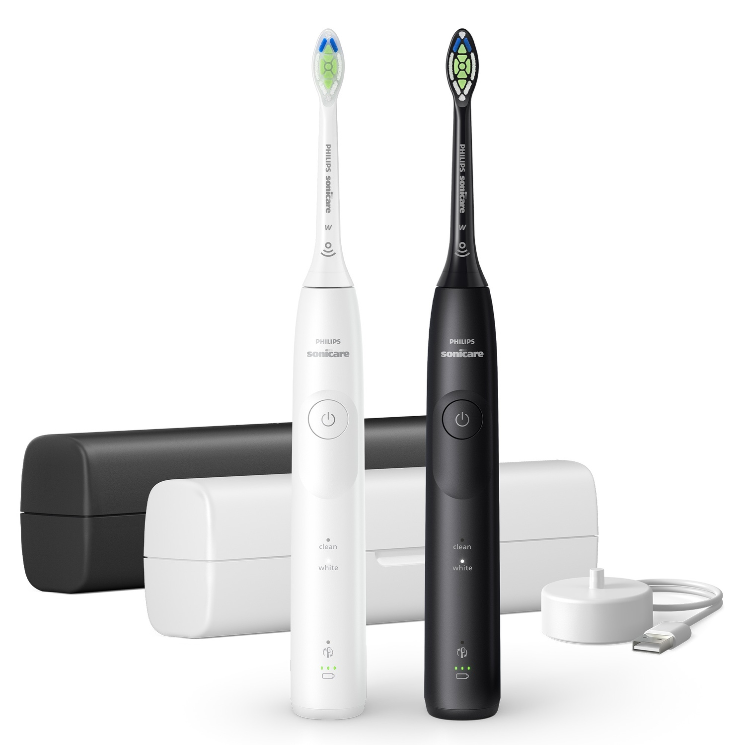 Deux brosses à dents électriques, une blanche, une noire, avec un chargeur et des étuis de voyage.