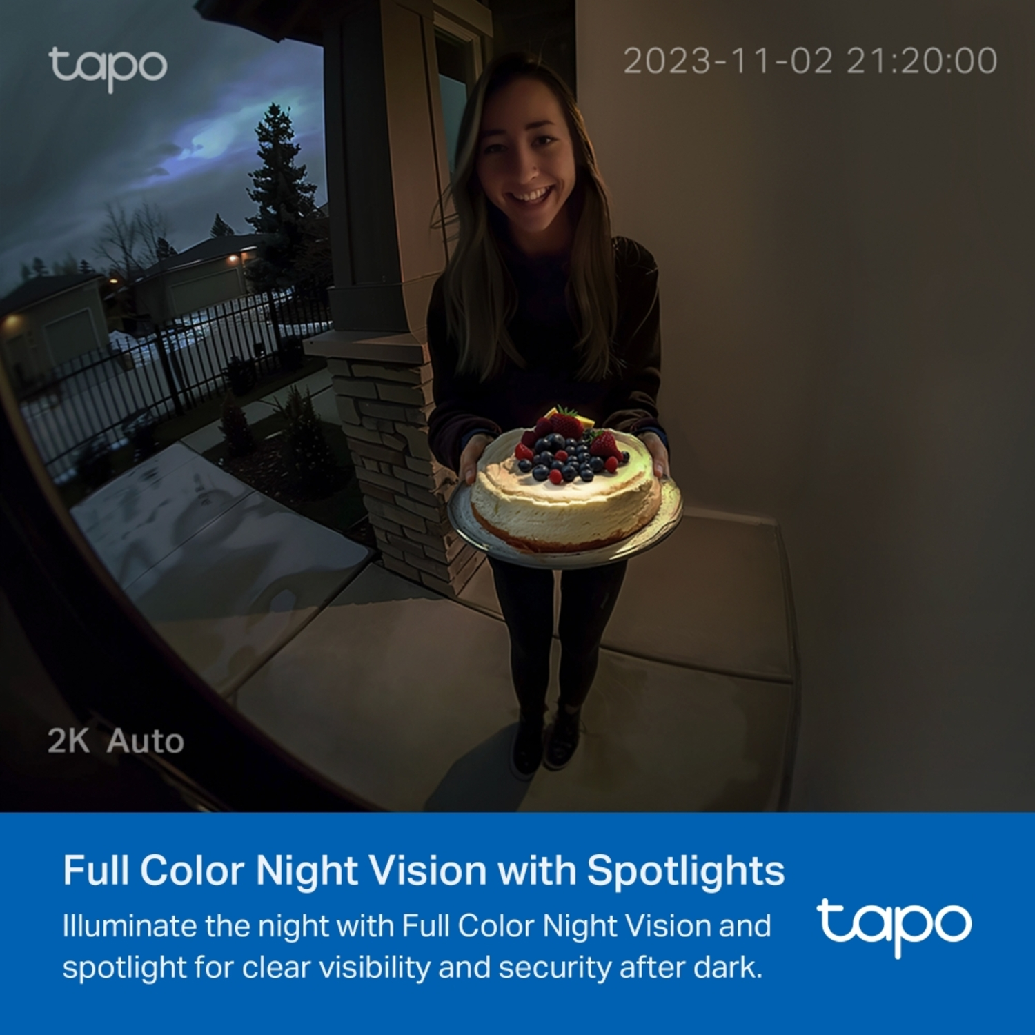 Woman holding cake at night, recorded by a security camera. The scene shows a house exterior.