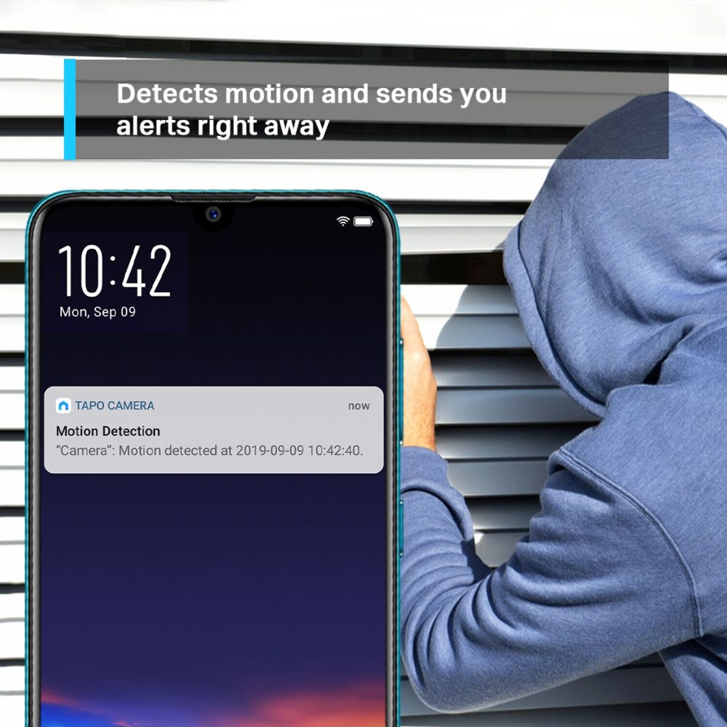 A phone shows a motion detection alert. A person in a blue hoodie peeks from behind a window.