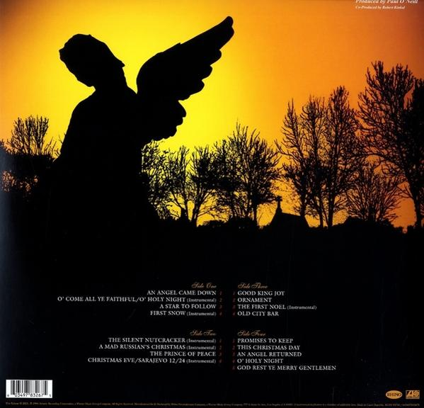 Az album hátsó borítója. Egy angyal sziluettje szárnyakkal, naplemente háttérrel és számlistával.