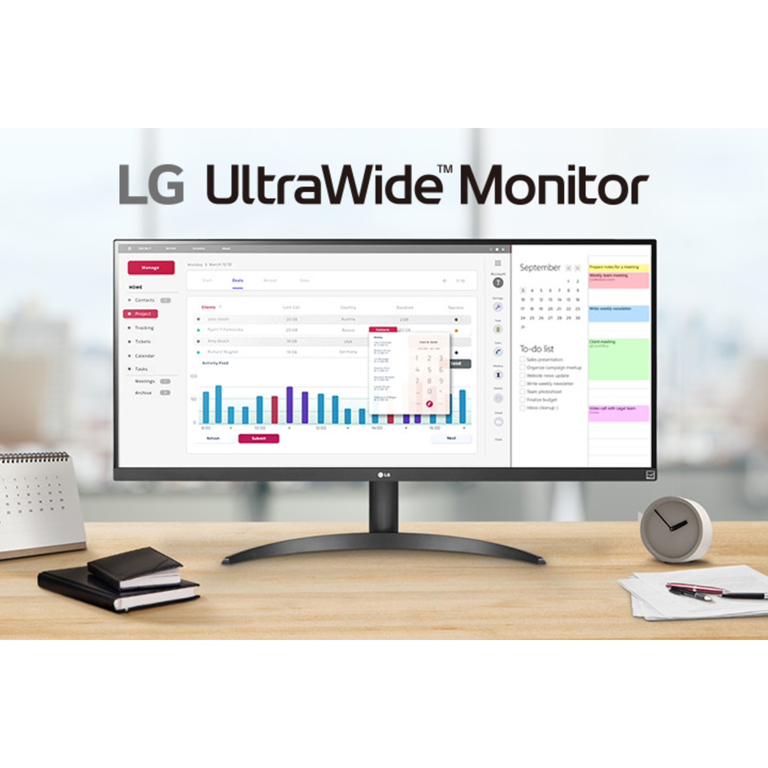An LG UltraWide monitor displays graphs and a calendar on a wooden desk.