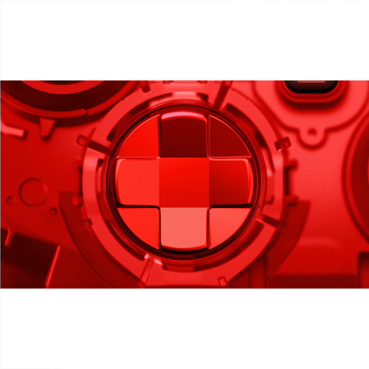 Zbliżenie czerwonego przycisku kontrolera gier z plusem na środku.