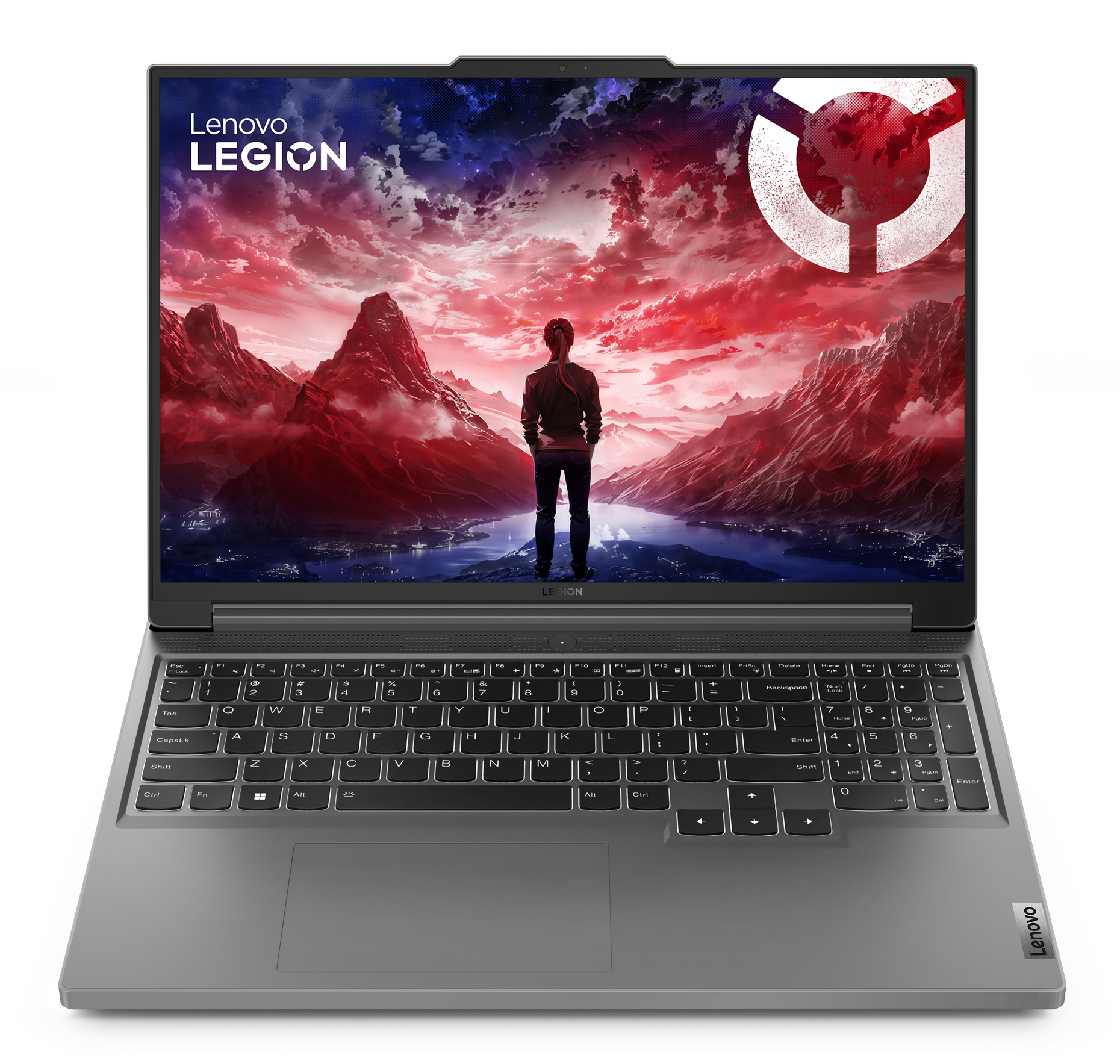 Srebrny laptop Lenovo Legion otwarty na czarnej powierzchni, pokazujący ekran gry. Logo Lenovo jest widoczne.