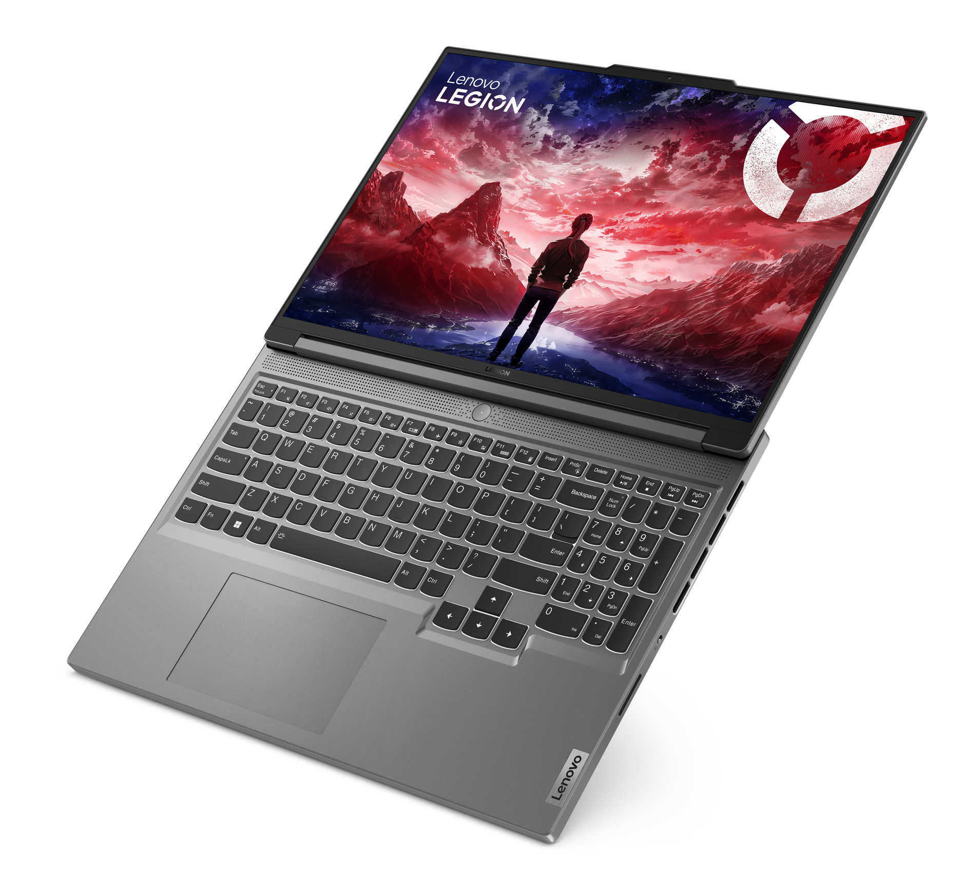 Laptop Lenovo Legion, otwarty na czarnej powierzchni pod kątem, pokazujący ekran gry. Widoczne logo Lenovo.