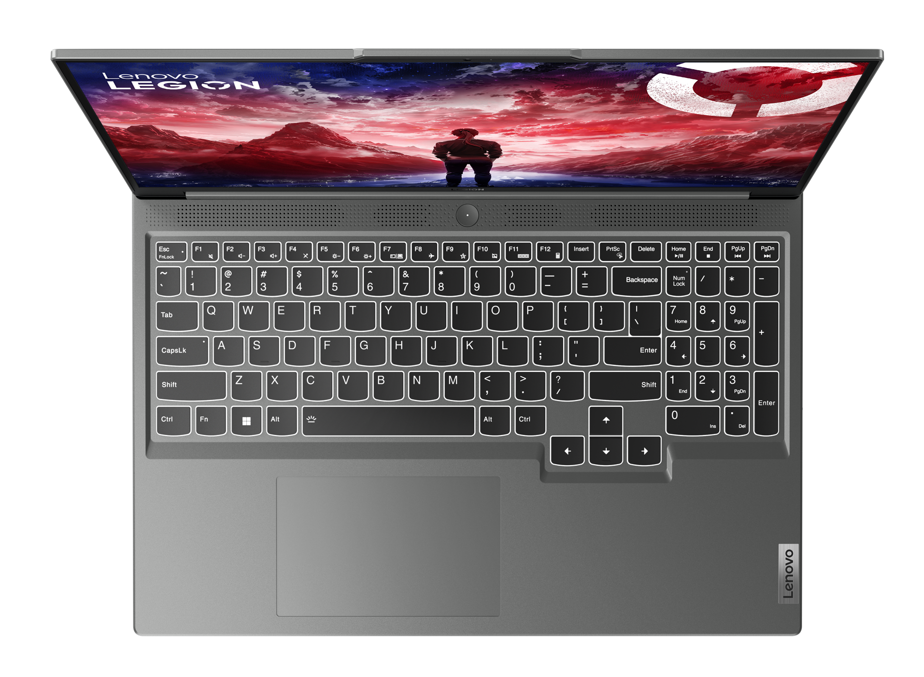 Widok z góry na laptopa, otwarty, pokazujący klawiaturę i ekran z grafiką.