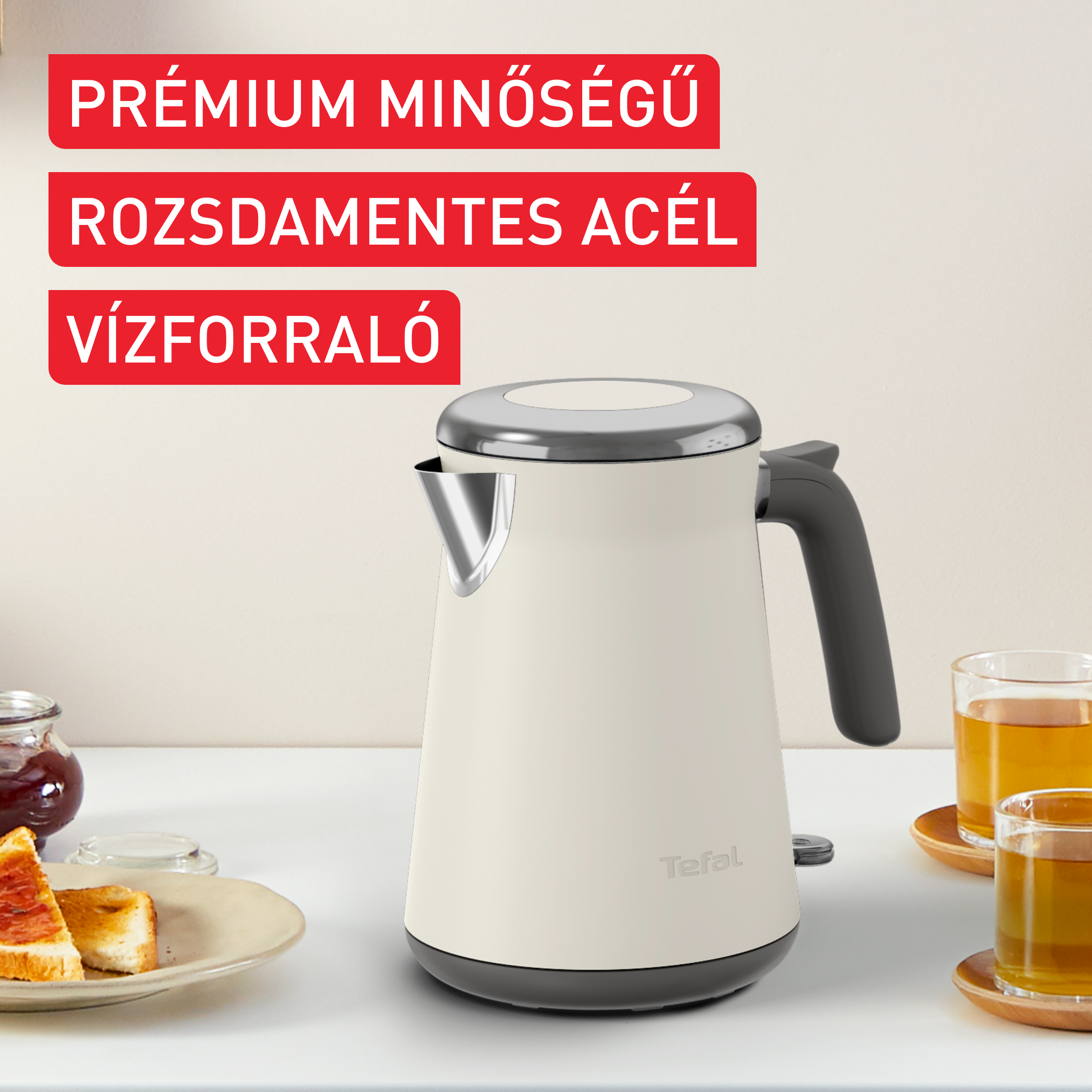 Fehér és szürke Tefal vízforraló, prémium minőségről szóló szöveggel.