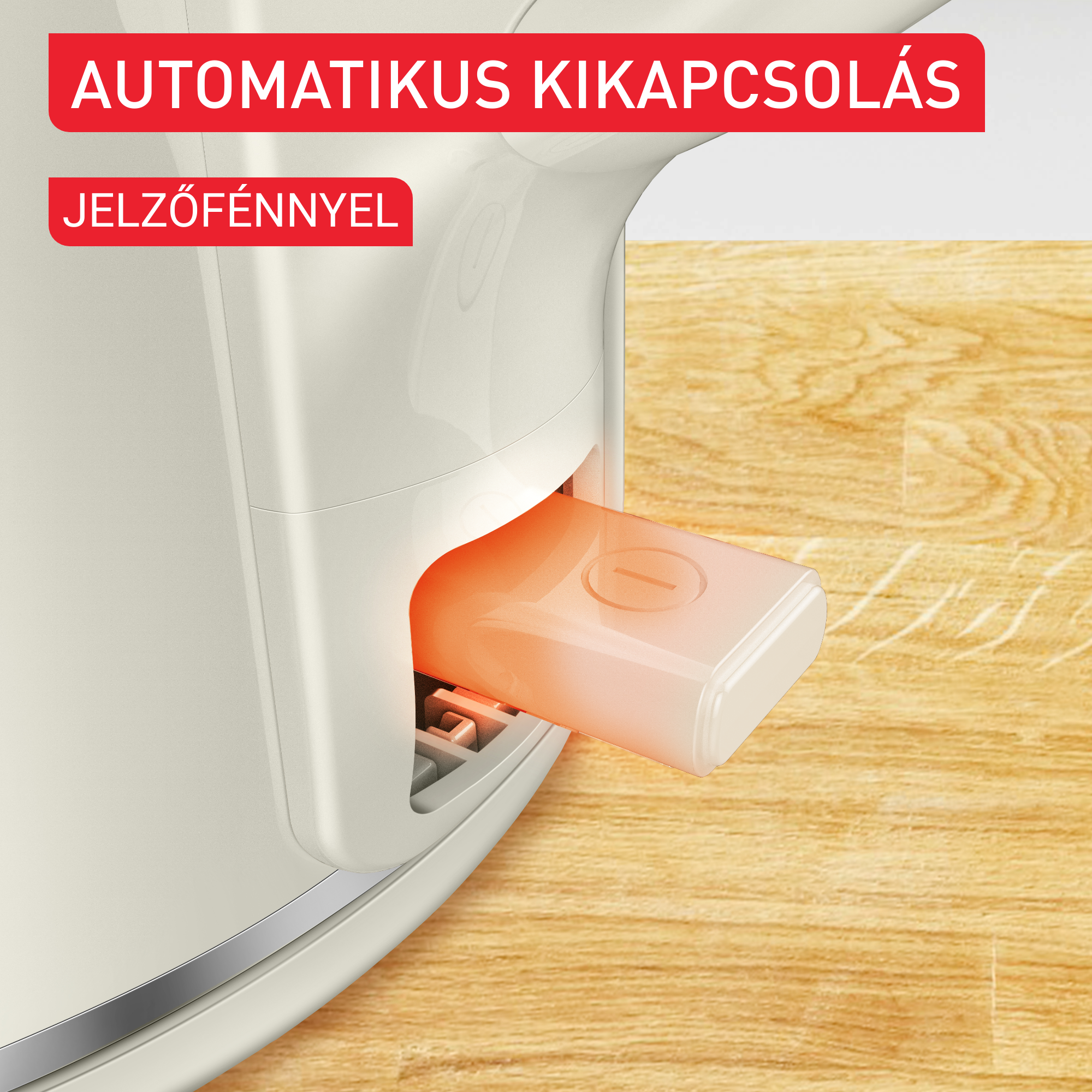 Krémszínű készülék közeli képe, nyitott narancssárga résszel.