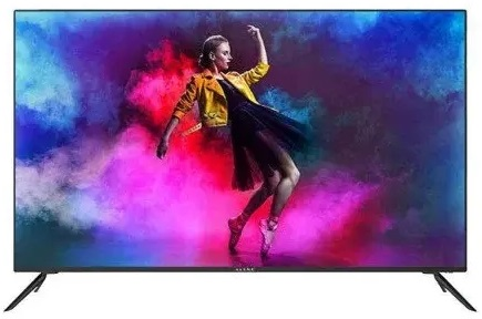 Telewizor wyświetla kobietę tańczącą na tle kolorowego tła.