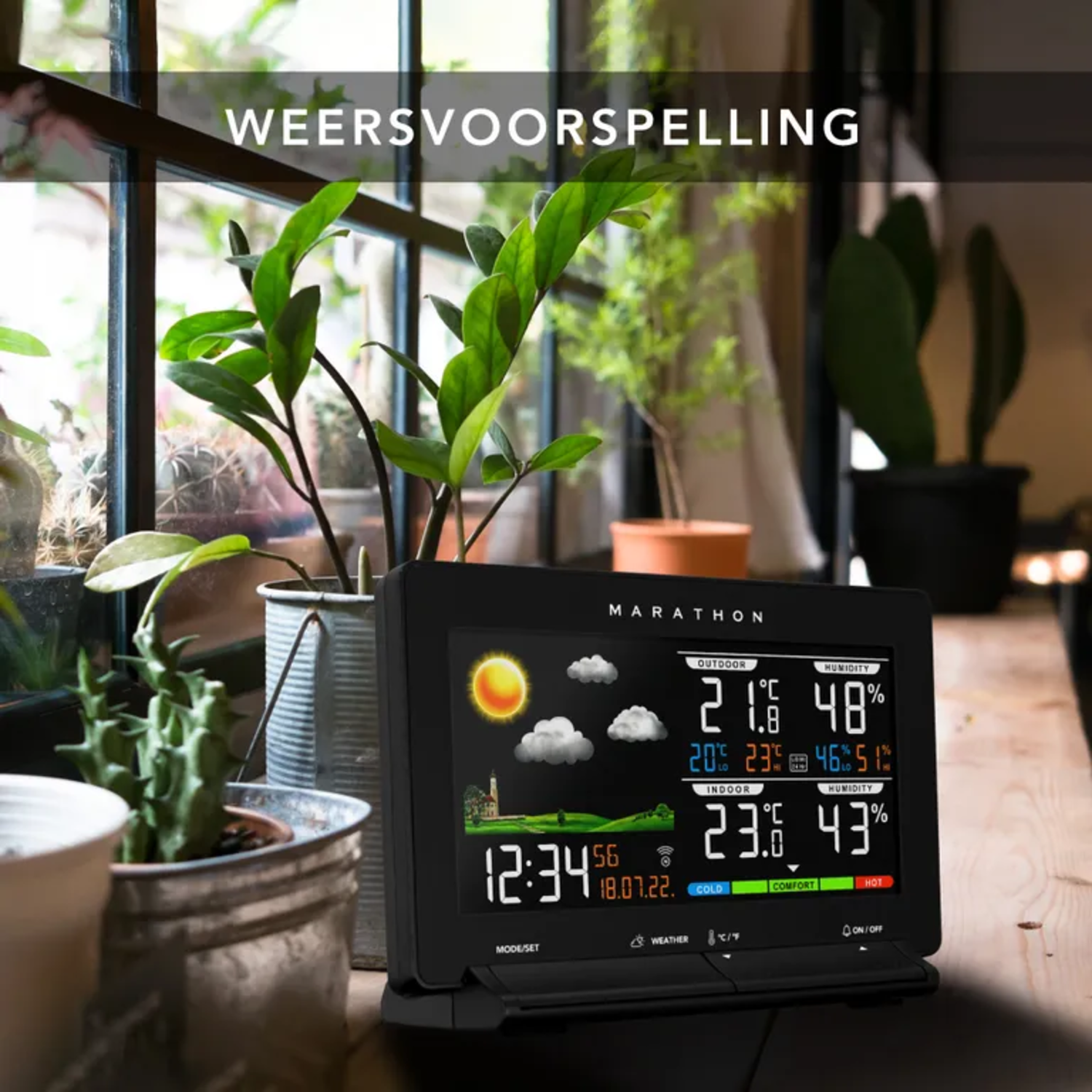 A weather station displaying outdoor and indoor temperatures, with a sunny and cloudy icon.