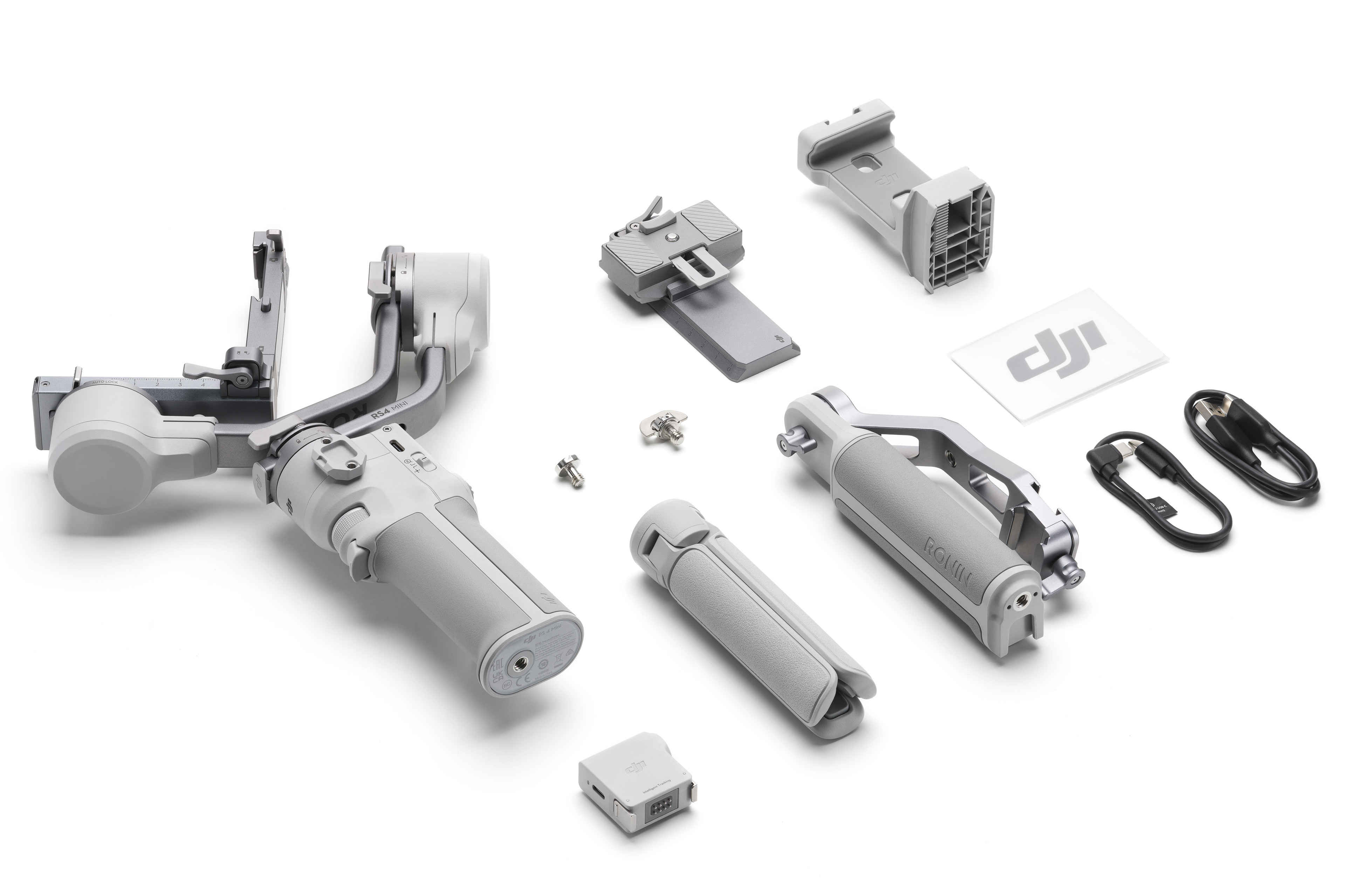 Zestaw akcesoriów do gimbala ręcznego, w tym uchwyt i statyw.