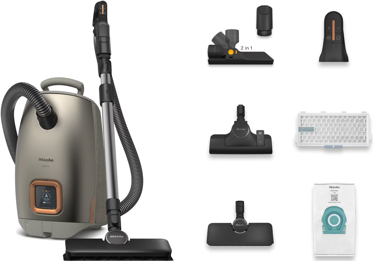 Aspirateur et accessoires. Sont montrés l'aspirateur, le tuyau et divers accessoires.