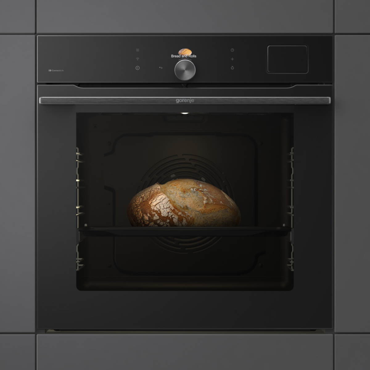 Sütő kenyérrel, sötétszürke szekrényen. Gorenje márka.