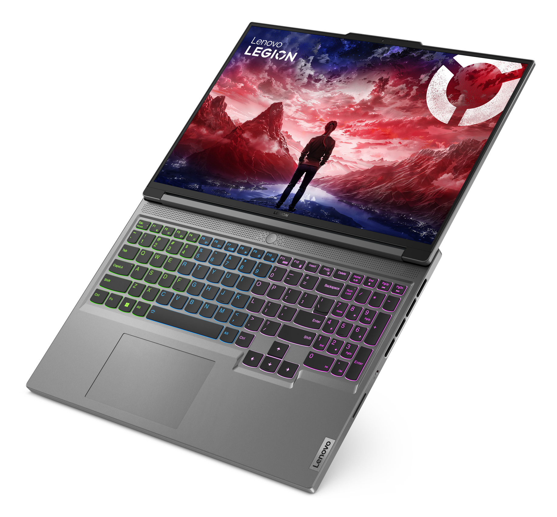 Laptop jest otwarty, pokazuje kolorową scenę z gry na ekranie. Klawiatura świeci się.