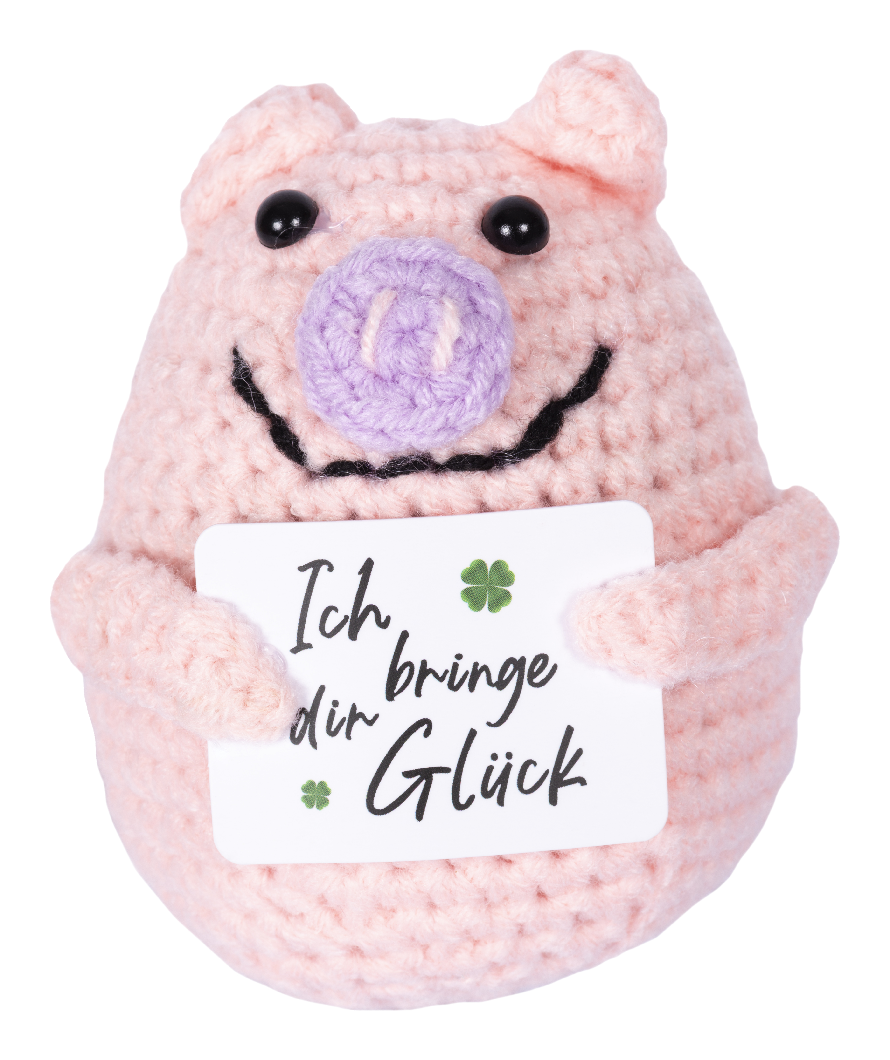 Rosa gehäkeltes Schwein hält Schild mit 'Ich bringe dir Glück' und Kleeblatt.