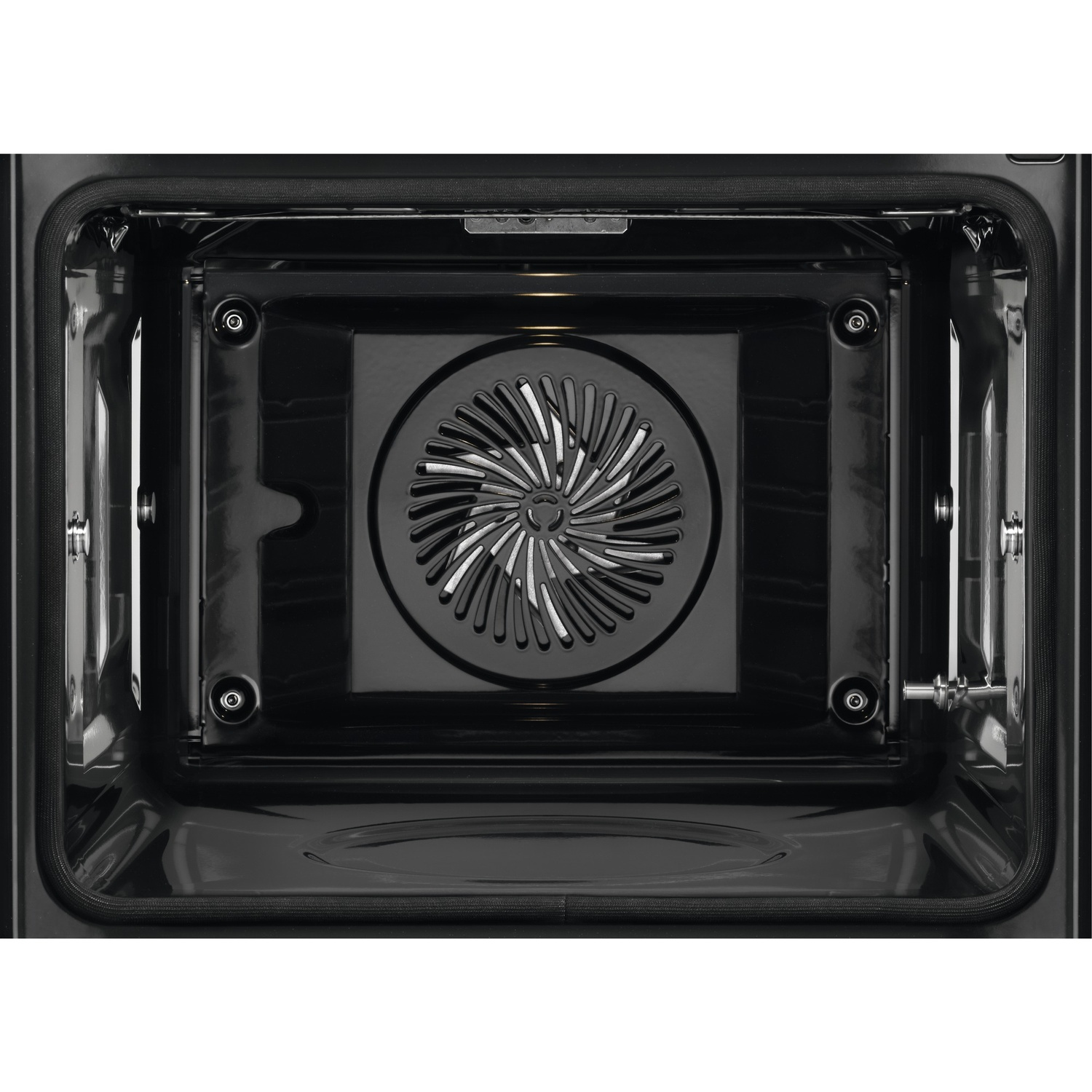 Intérieur d'un four noir, montrant un ventilateur et l'intérieur du four.