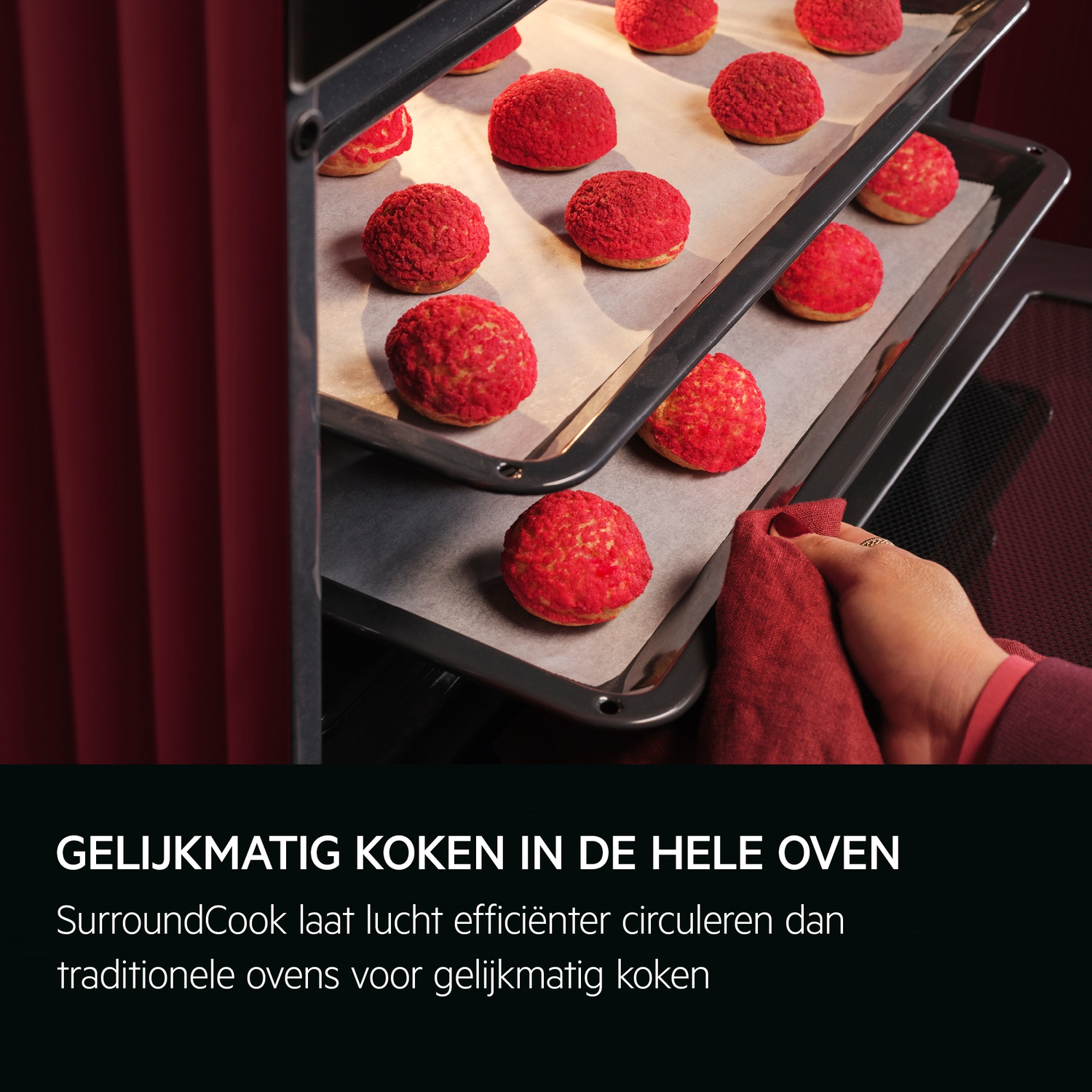 Oven interior with trays of red-topped pastries, a hand holding a cloth, and text below.