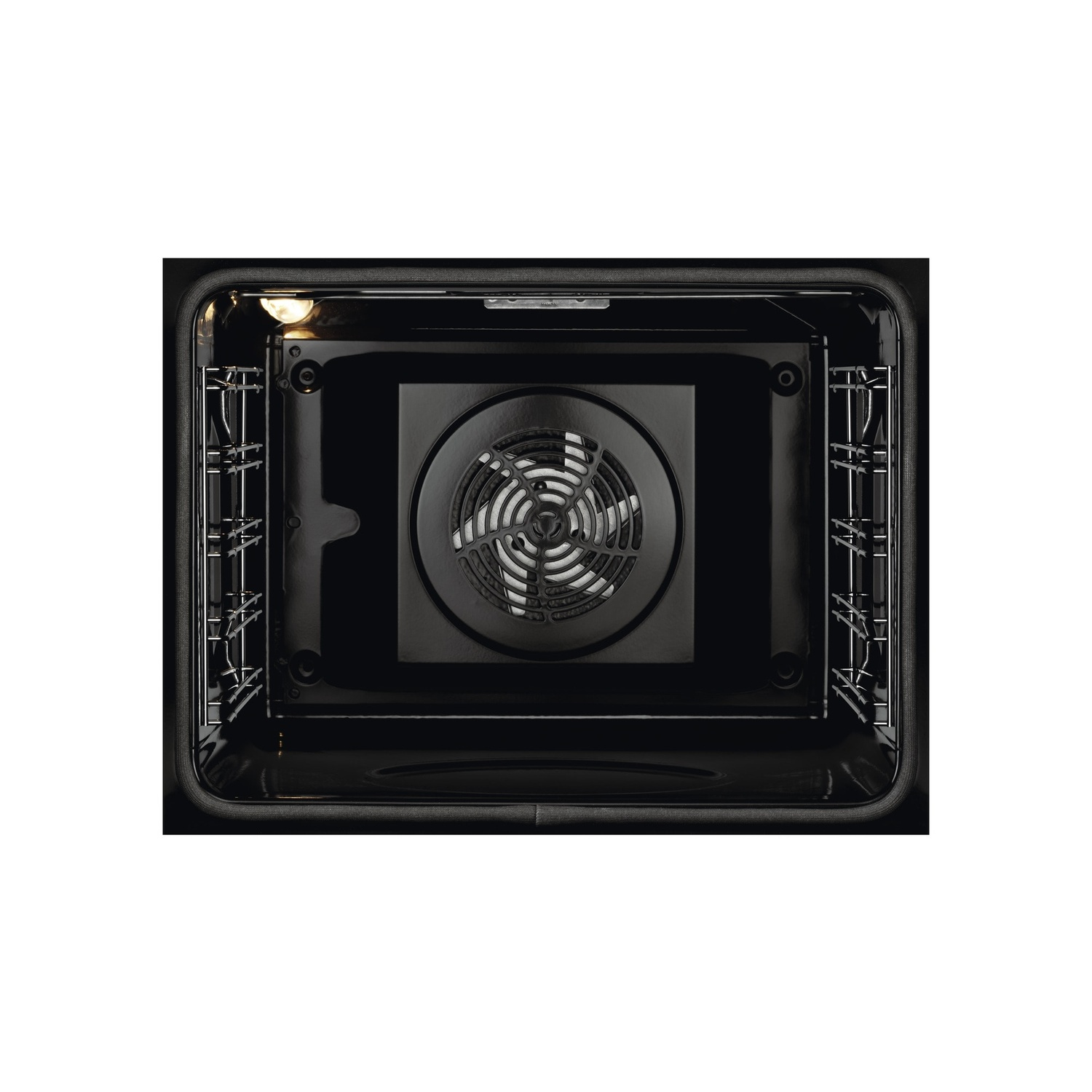 Oven interior with racks and a fan. Dark interior lighting.