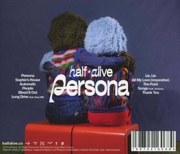 Albumcover mit zwei Puppen auf rotem Ständer. Text beinhaltet 'Persona' und Trackliste.