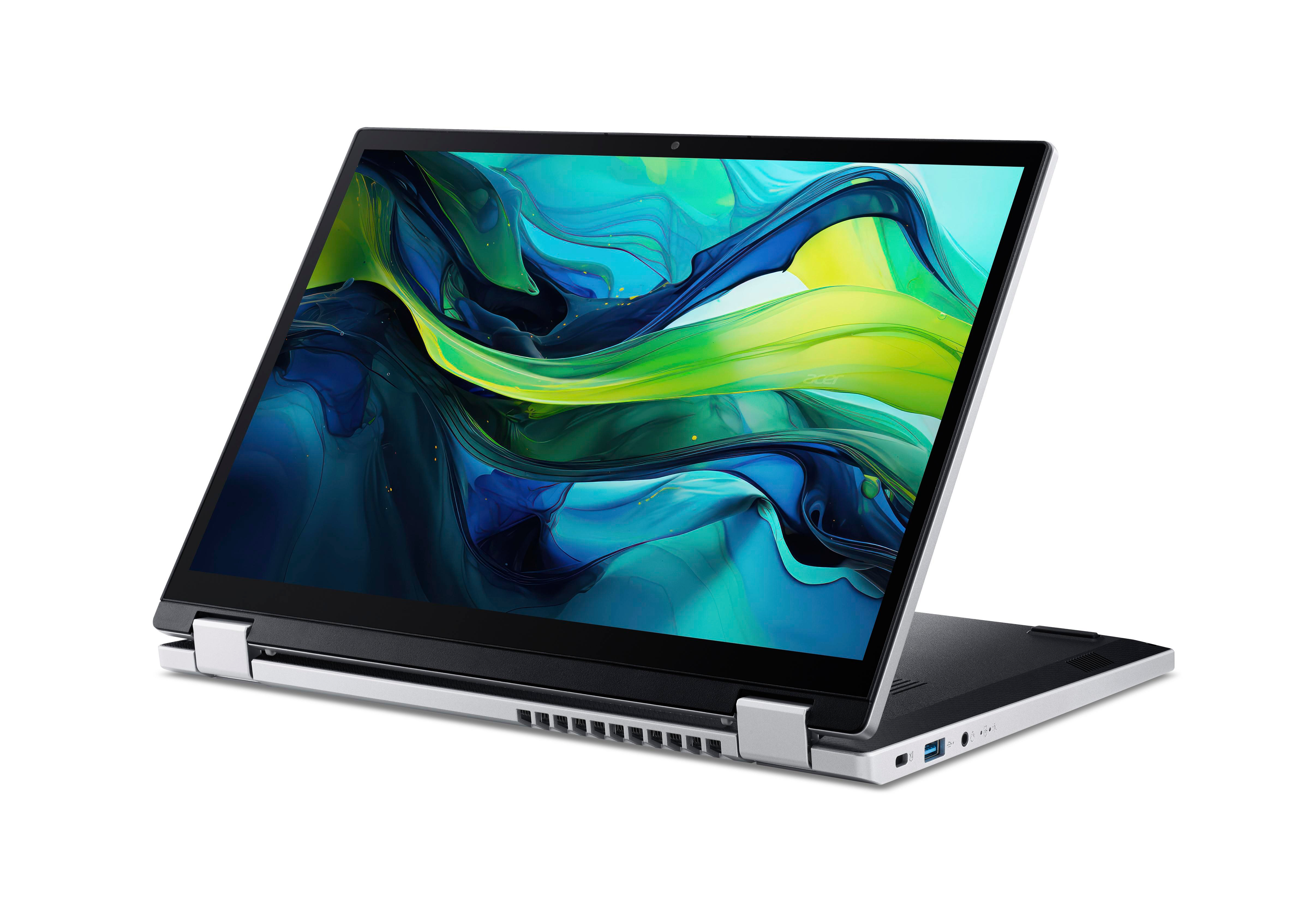 Ein silberner und schwarzer Laptop ist auf einer weißen Oberfläche geöffnet. Der Bildschirm zeigt ein grün-gelbes Bild.