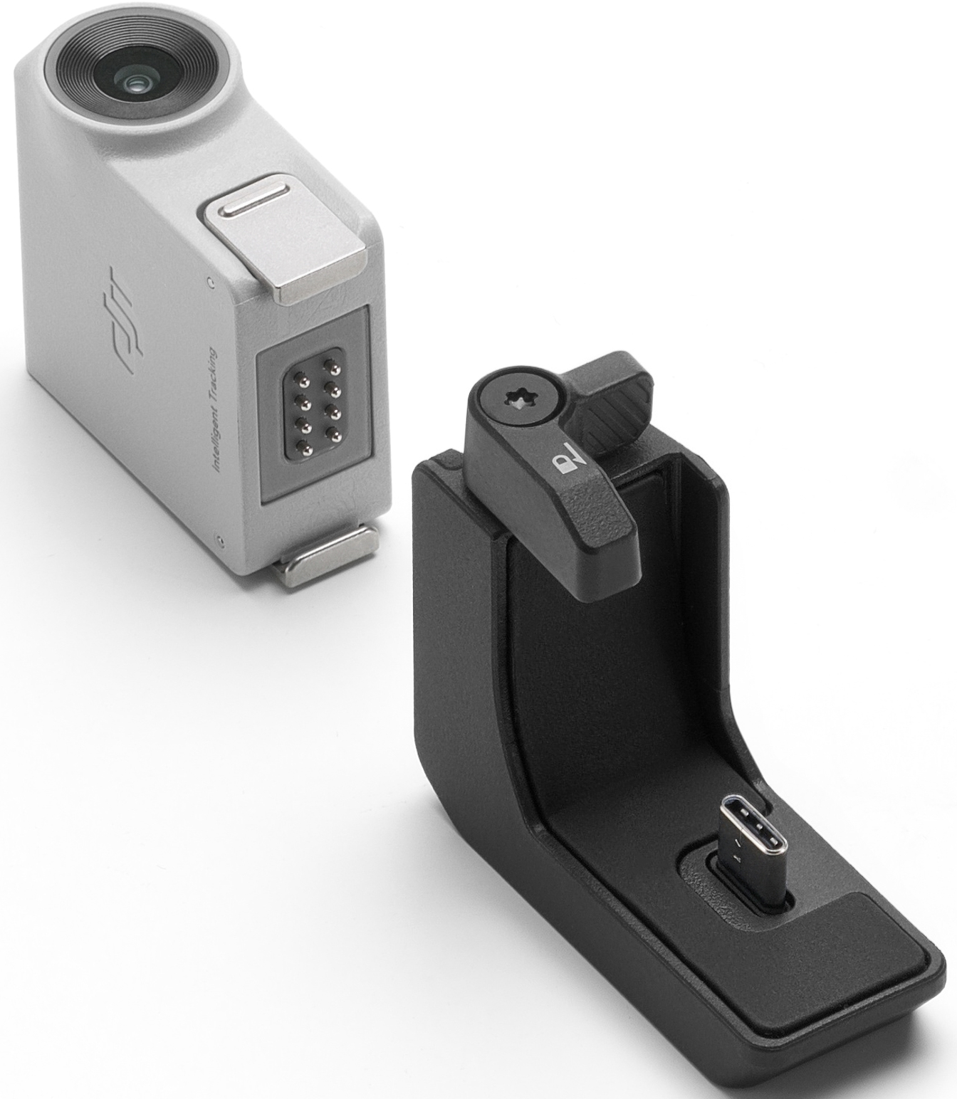 Caméra argentée avec objectif et socle de chargement noir avec port USB-C.