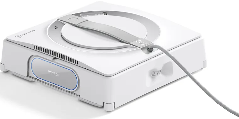 Pulitore per vetri robotico bianco con maniglia grigia e cavo di alimentazione, su una superficie bianca.