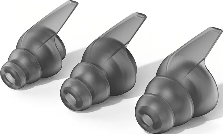 Trois embouts d'oreille gris pour écouteurs, conçus pour le confort et l'isolation phonique.
