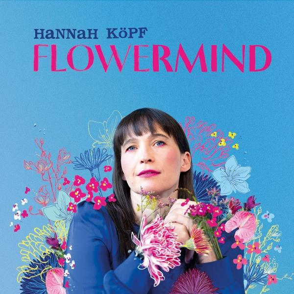 Albumcover mit einer Frau mit Blumen und Text auf blauem Hintergrund.