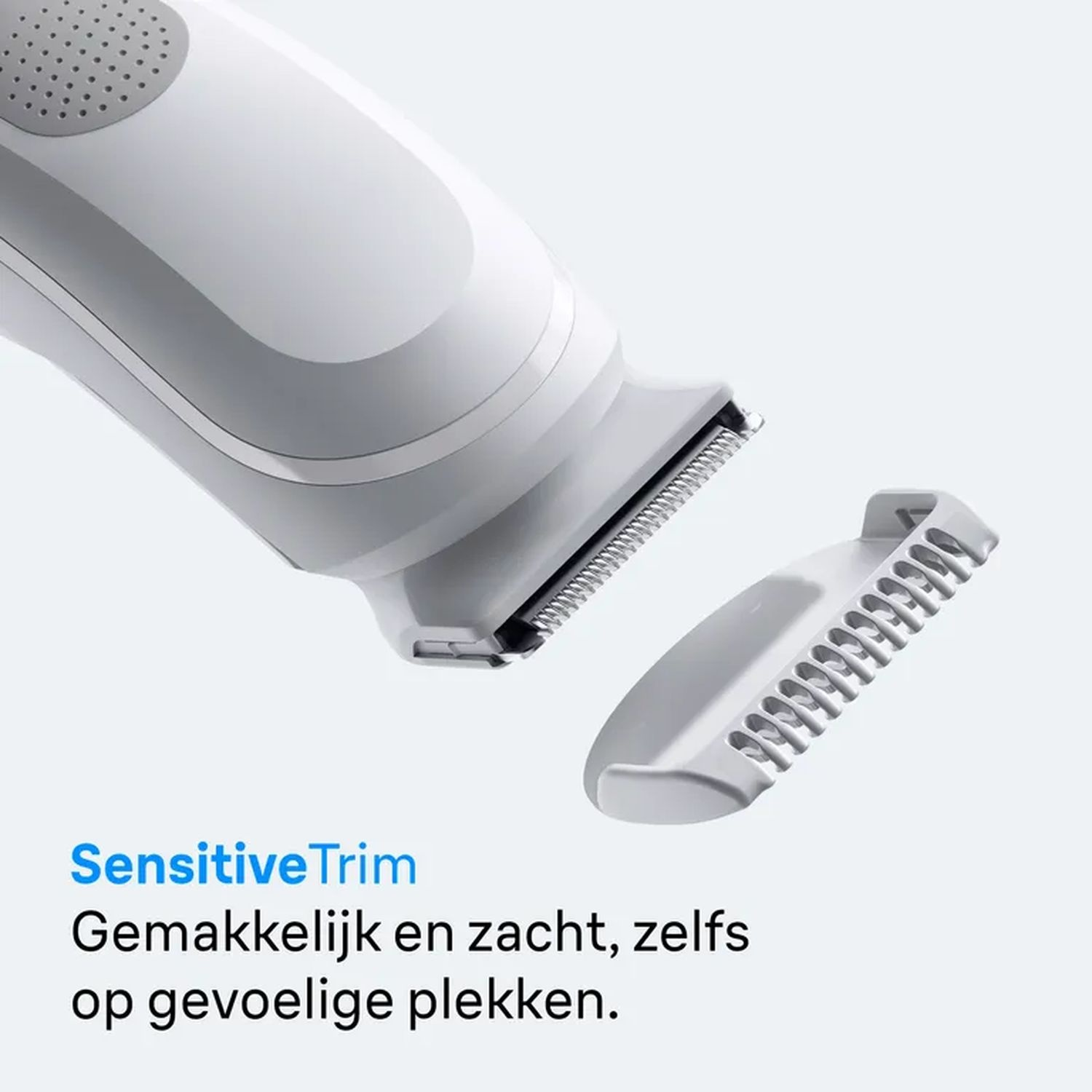 White shaver with a detachable head and a comb attachment, text reads SensitiveTrim.
