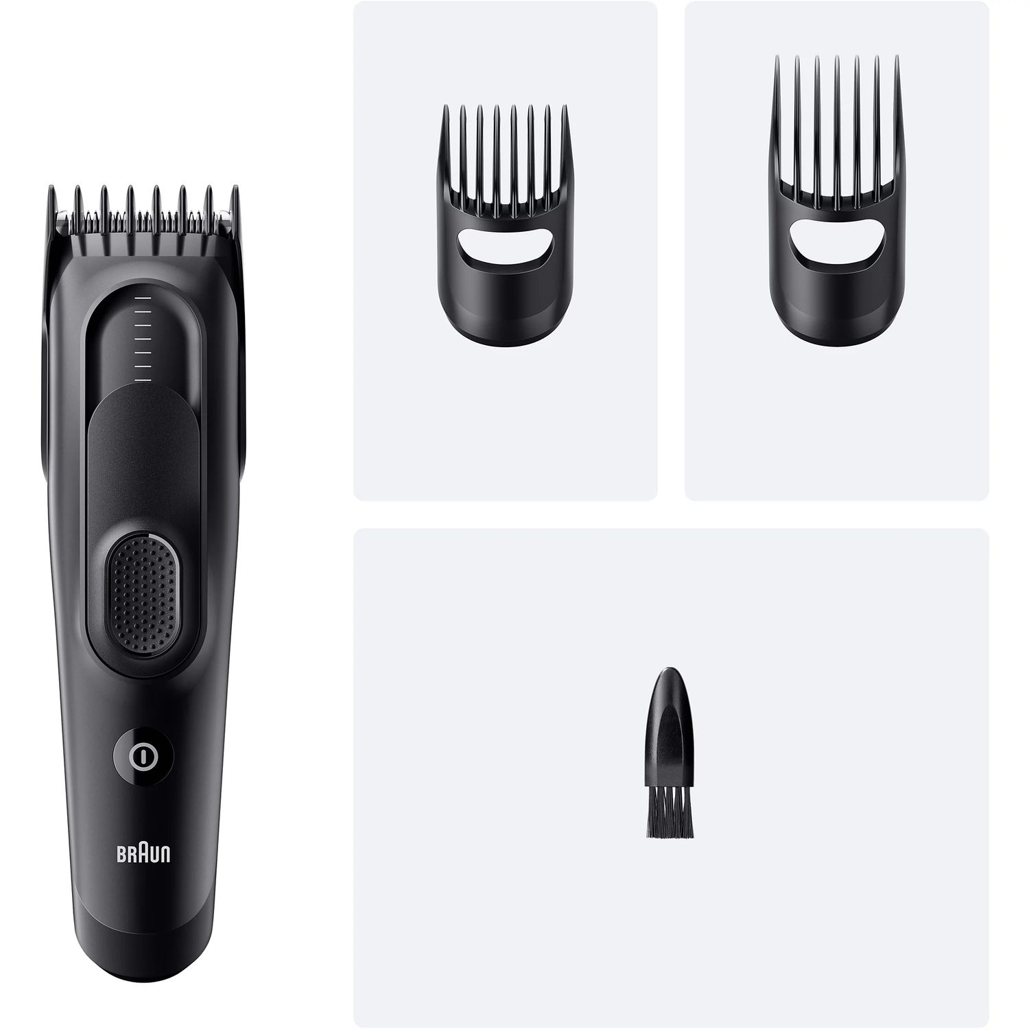 Une tondeuse à barbe noire avec différents accessoires.