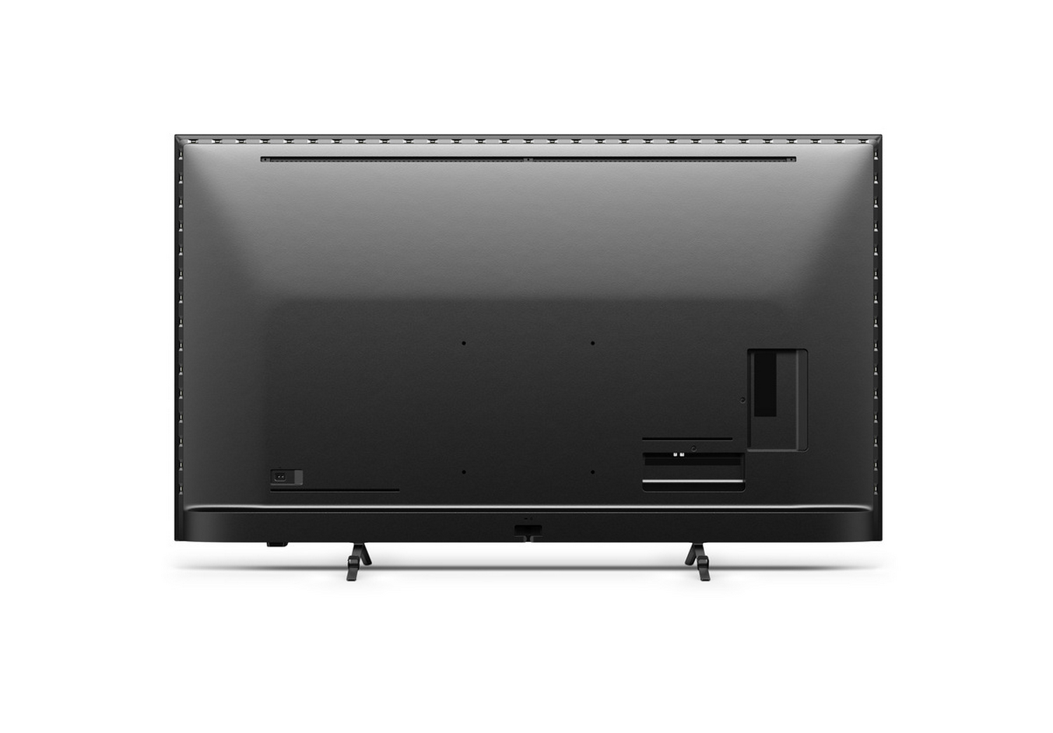 Parte trasera de un televisor negro con puertos y soportes visibles.