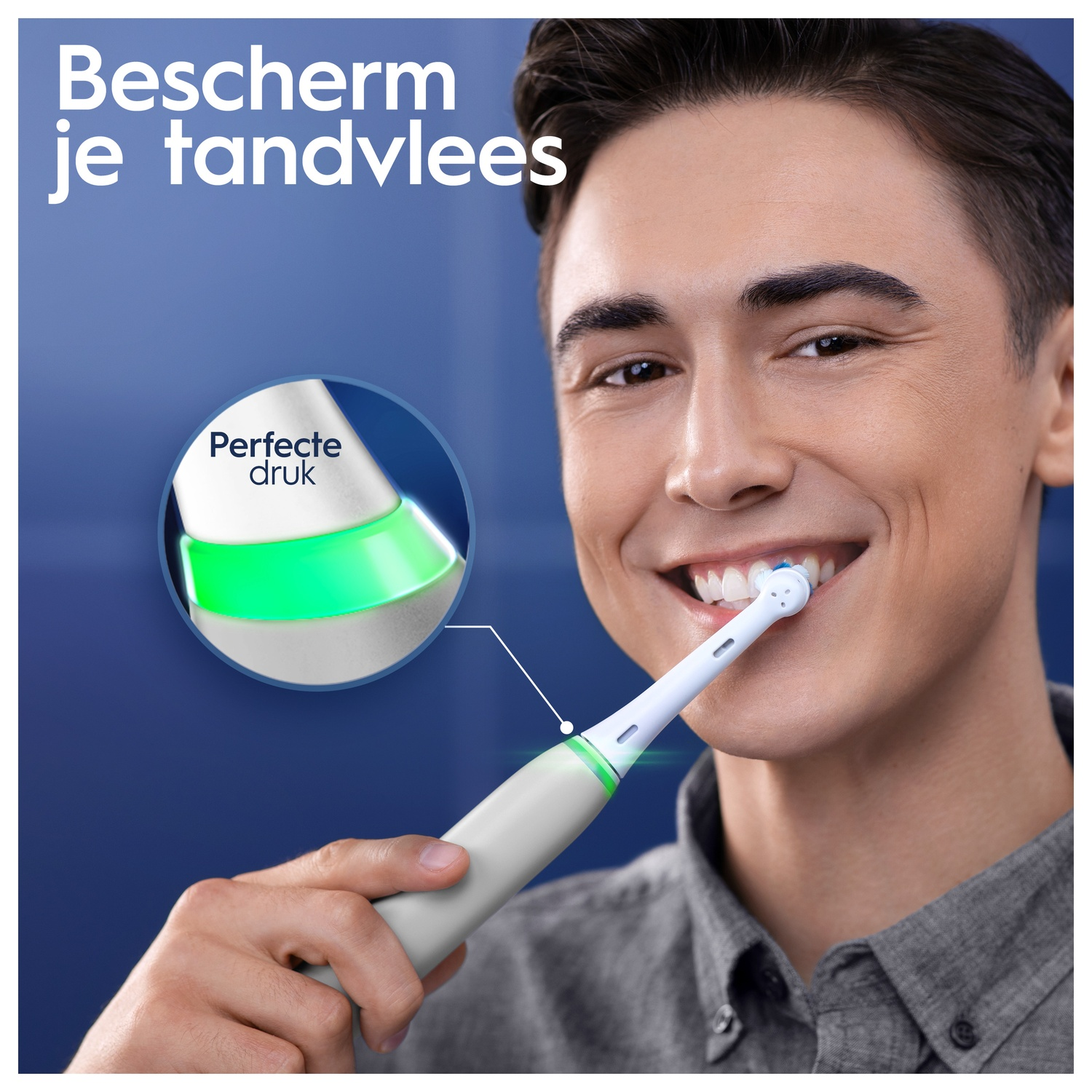 Man smiling, brushing teeth. A green light indicates correct pressure. Close-up of toothbrush.