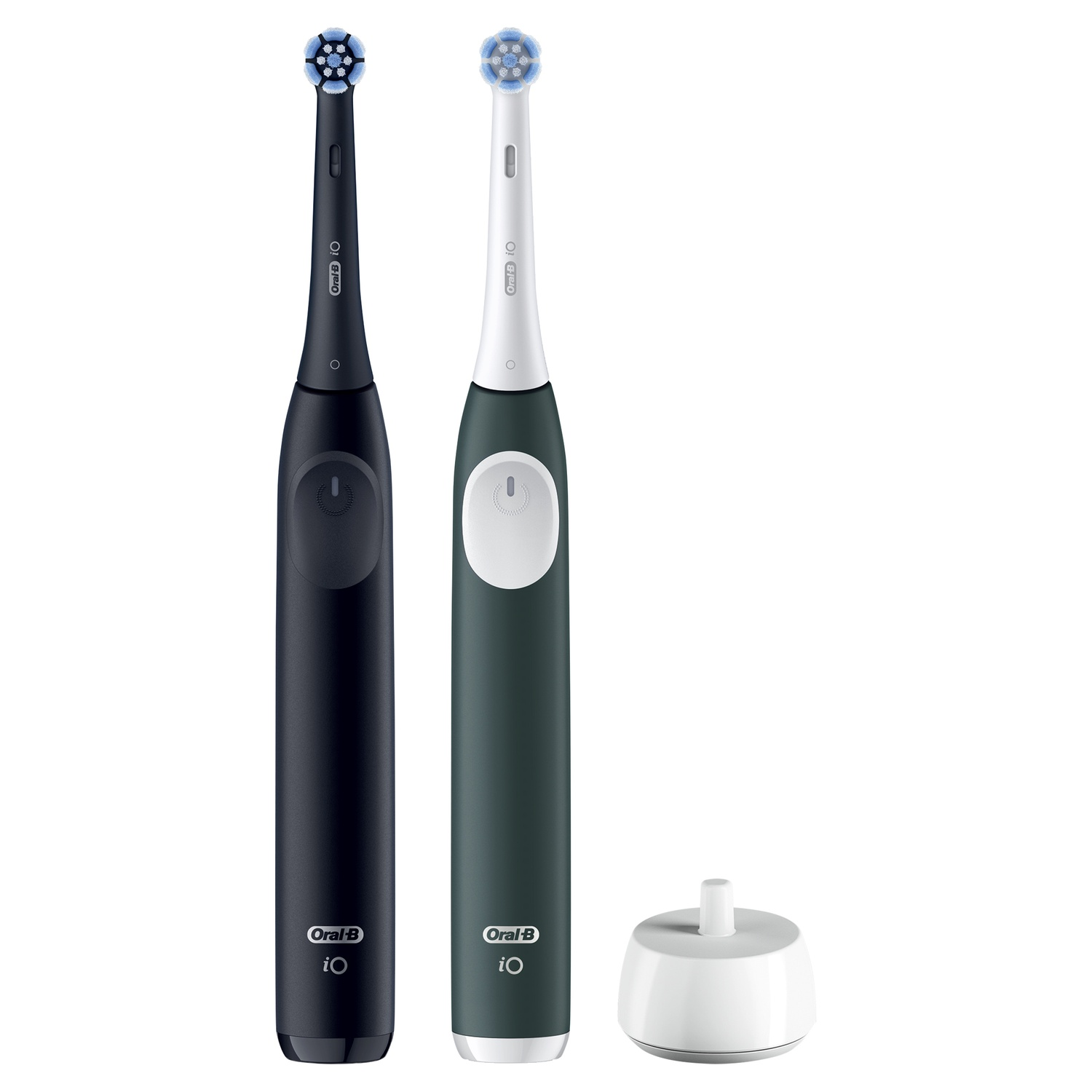 Deux brosses à dents électriques noires et vertes et une base de chargement blanche.