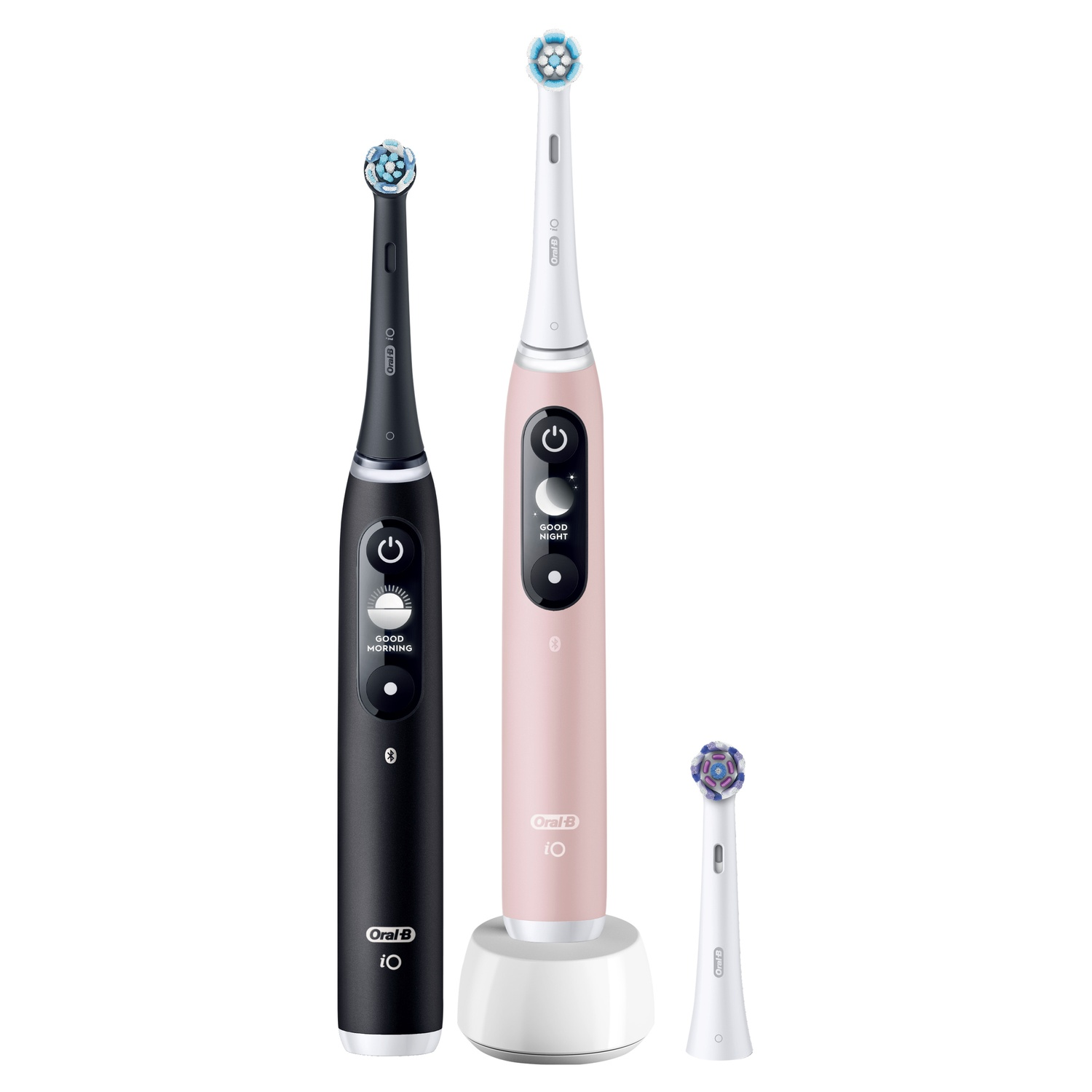 Two electric toothbrushes and a spare head. One black, one pink, on a white stand.