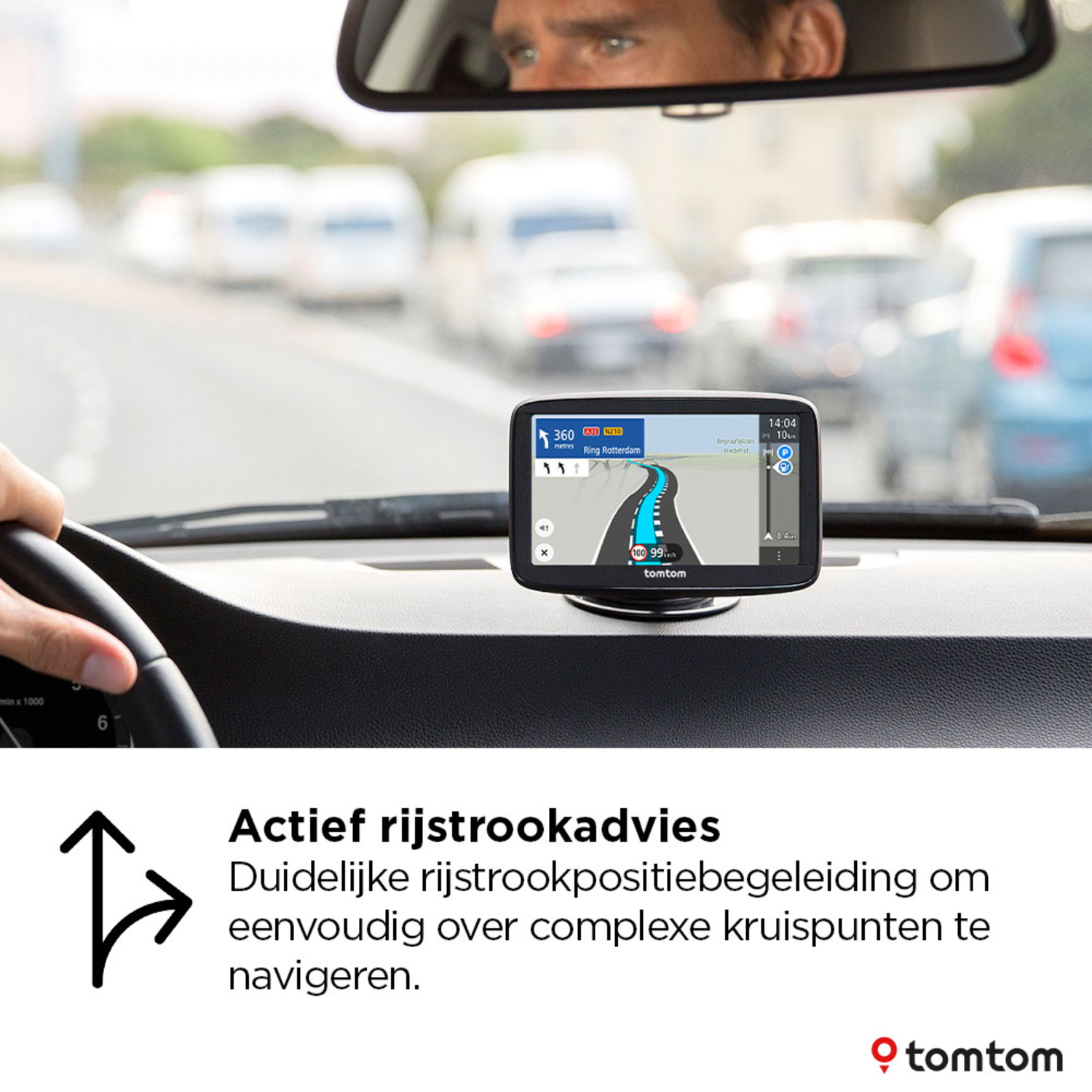 A car dashboard with a GPS showing a map. A hand is on the steering wheel.