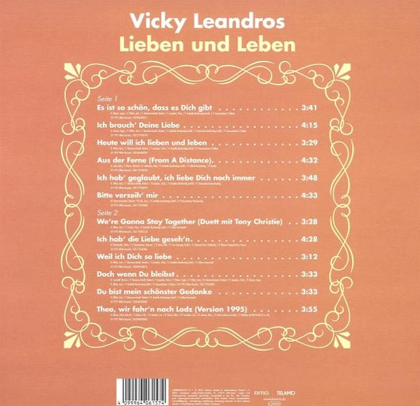 Albumcover mit dem Text "Vicky Leandros Lieben und Leben". Oranger Hintergrund.