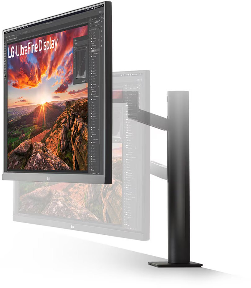 Egy LG monitor kijelző, döntve. A háttér elmosódott, egy hegyvidéki tájat mutatva.