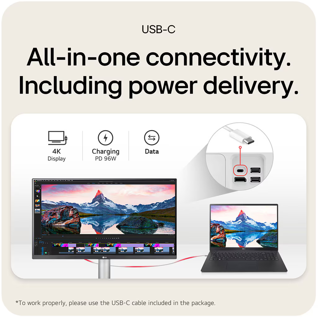 Egy monitor és egy laptop USB-C kábellel összekötve. A monitor egy tájképet mutat.