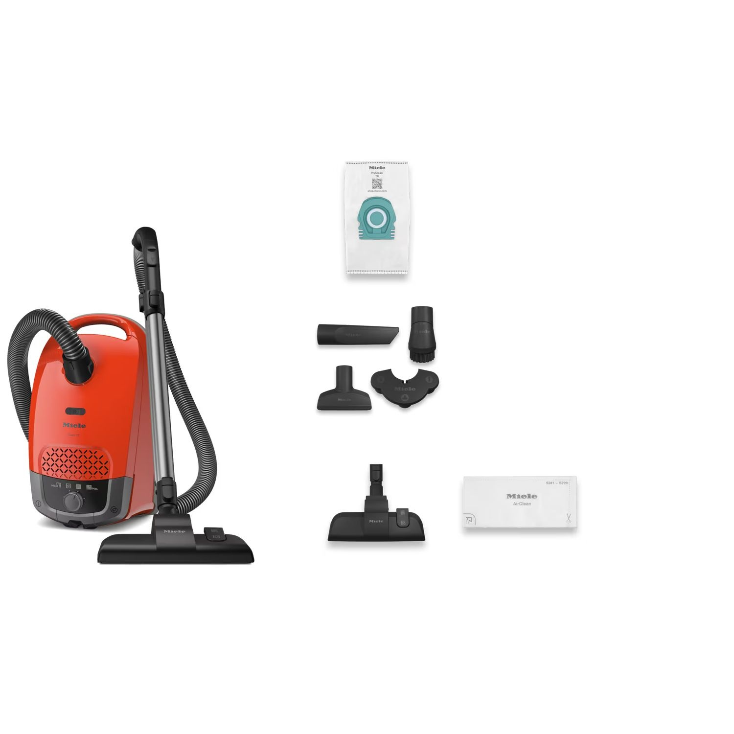 Aspirateur orange avec accessoires, sac et accessoires, sur fond blanc.