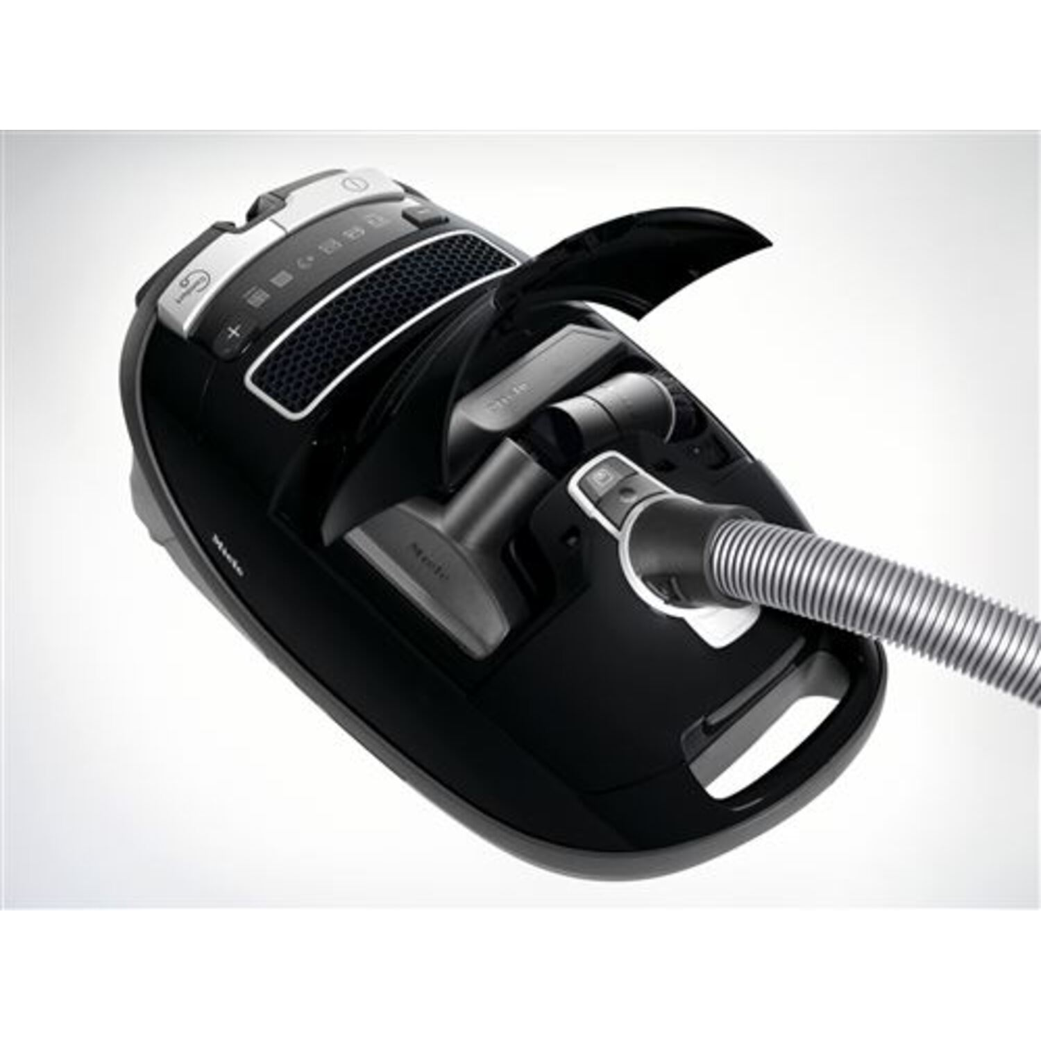 A black vacuum cleaner with open compartment.