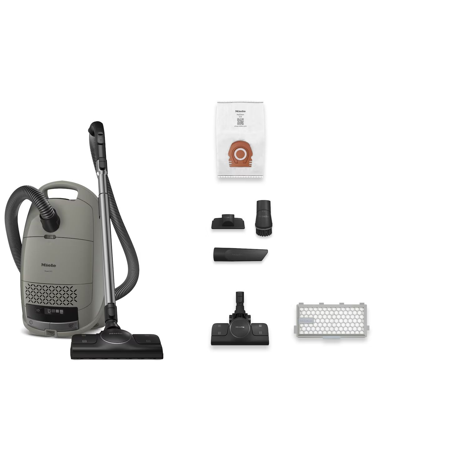 Aspirateur et accessoires, dont des sacs, des buses et un filtre.