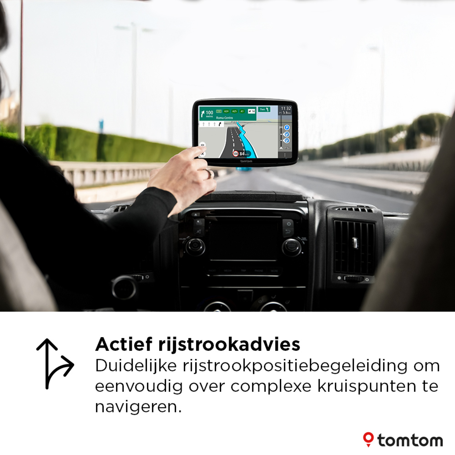 Man holding a GPS device in a car. The GPS shows a map with directions. Dashboard visible.
