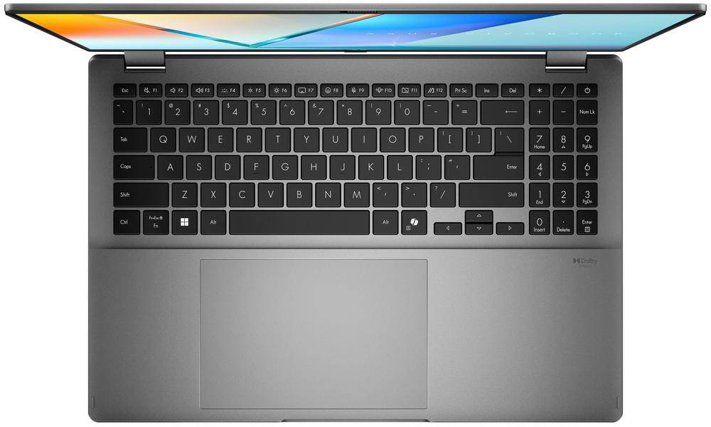 Laptop billentyűzettel és nyitott képernyővel felülnézetben. A képernyő színes képet jelenít meg.