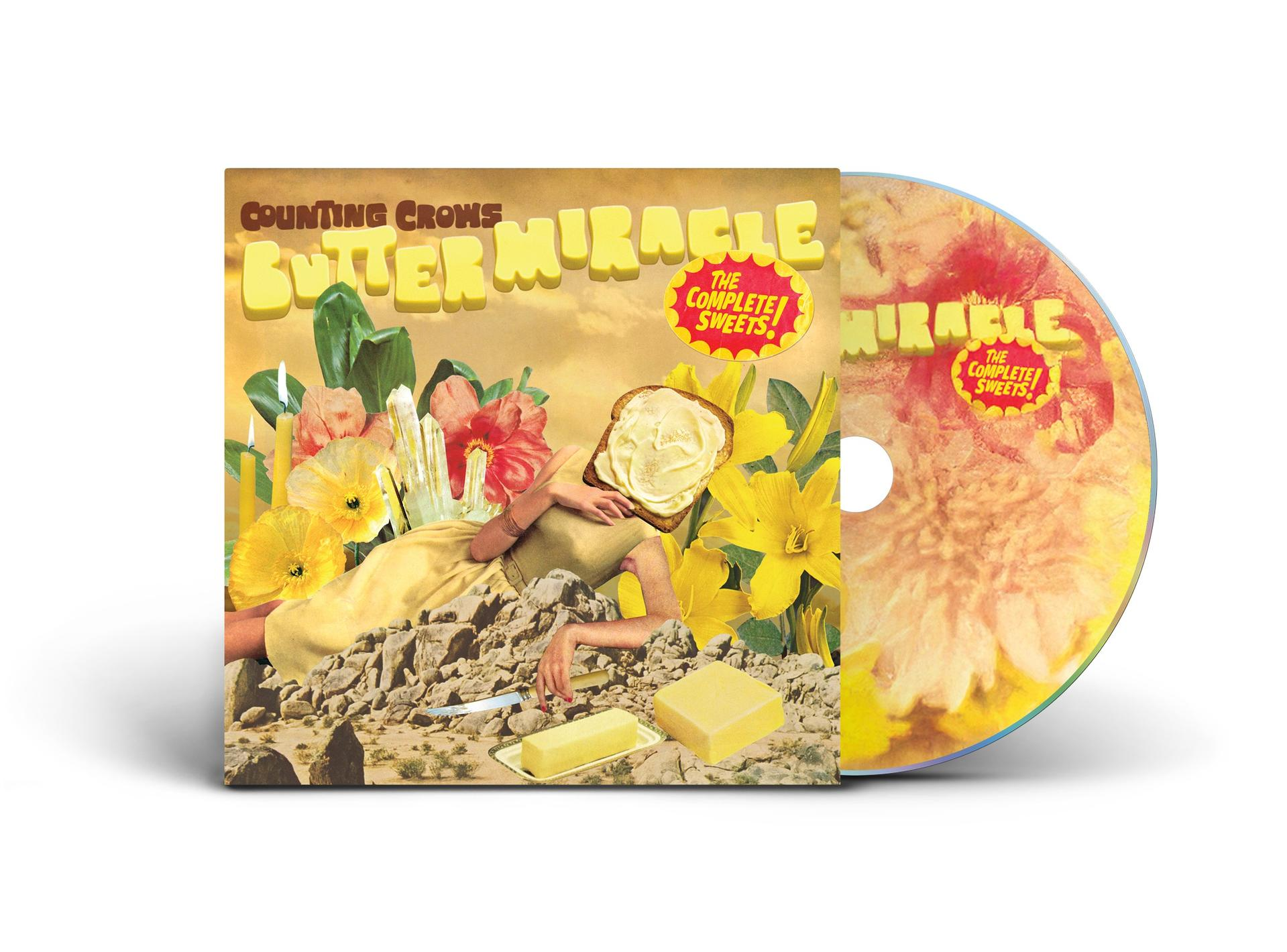 Albumcover mit gelbem Thema, surreale Kunst. Eine CD liegt neben dem Album.