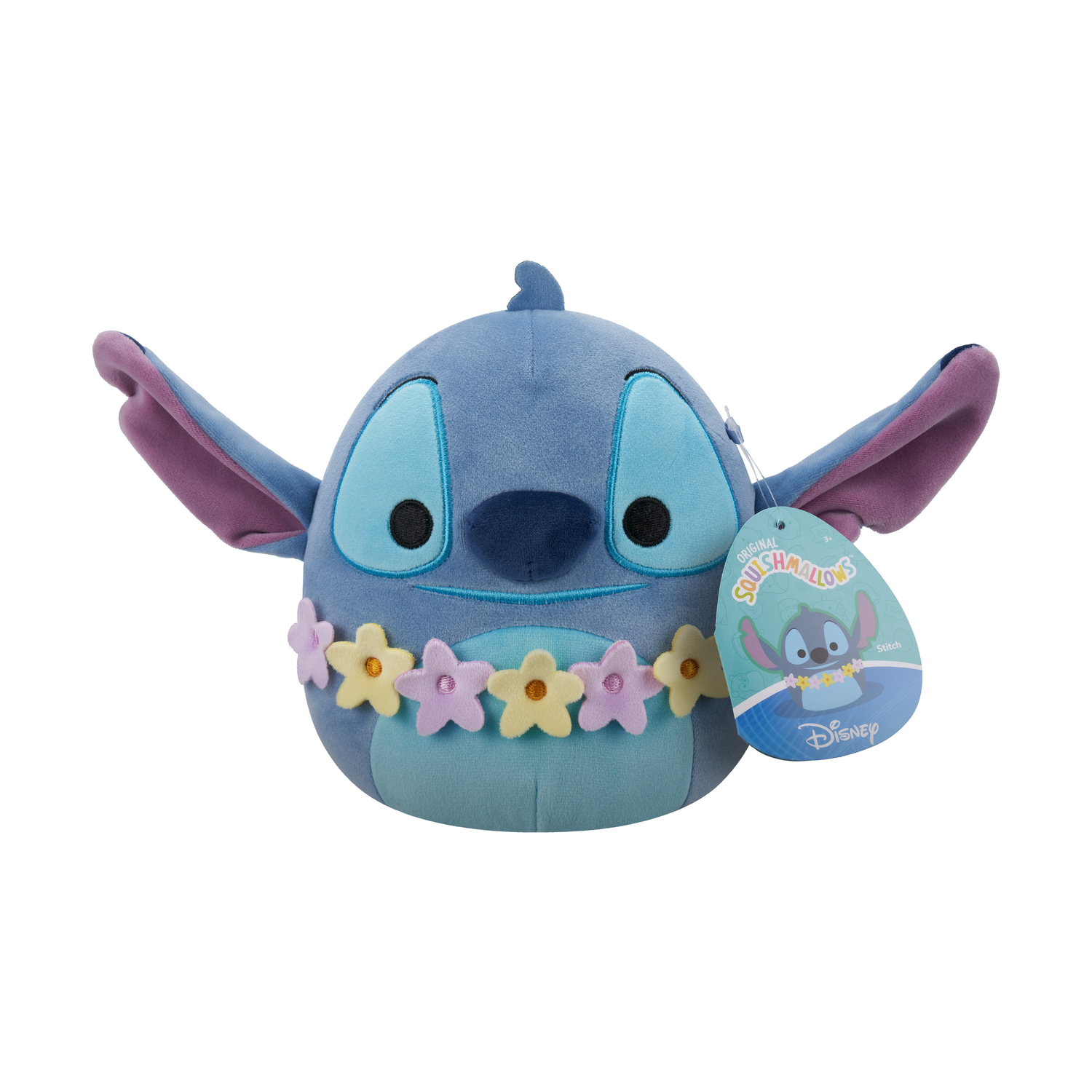 Peluche blu di Stitch con ghirlanda di fiori ed etichetta, su sfondo bianco.